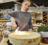 Flaming Cheese Wheel and Wine Pairing Experience - ACT Tourism