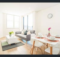 Gorgeous modern brand new two bedroom apartment with large lounge and private garden view balcony - ACT Tourism